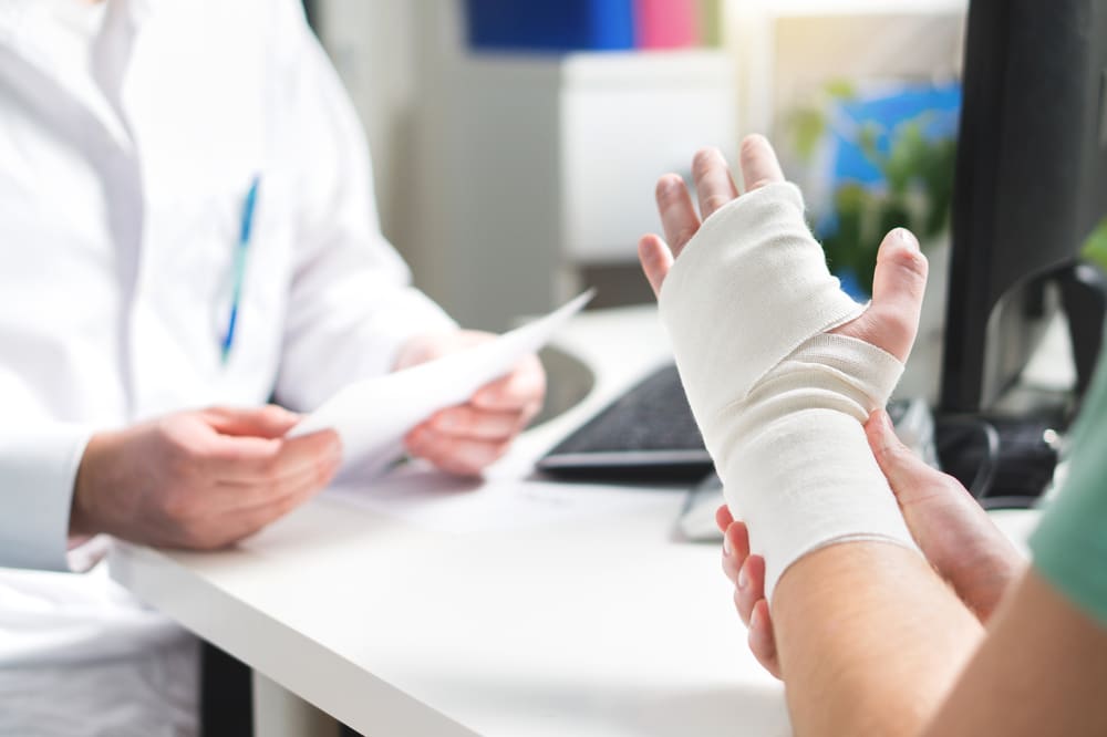 Man Showing Doctor Injured Wrist | Medical Malpractice Lawyers in NYC | Gash & Associates, P.C.