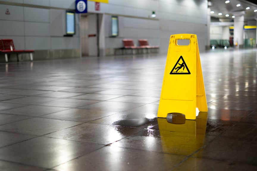 Wet Floor With Yellow Wet Slippery Sign | Slip and Fall Accident Attorneys | Gash & Associates, P.C.