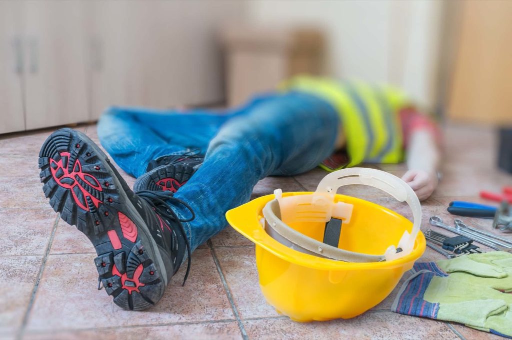 Injured Worker at Work Lying on the Floor | Construction Accidents Lawyer | Gash & Associates, P.C.
