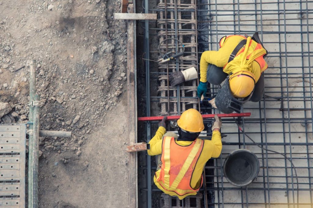 Two Workers Working in Construction Site | Workplace Injury Lawyer | Gash & Associates, P.C.