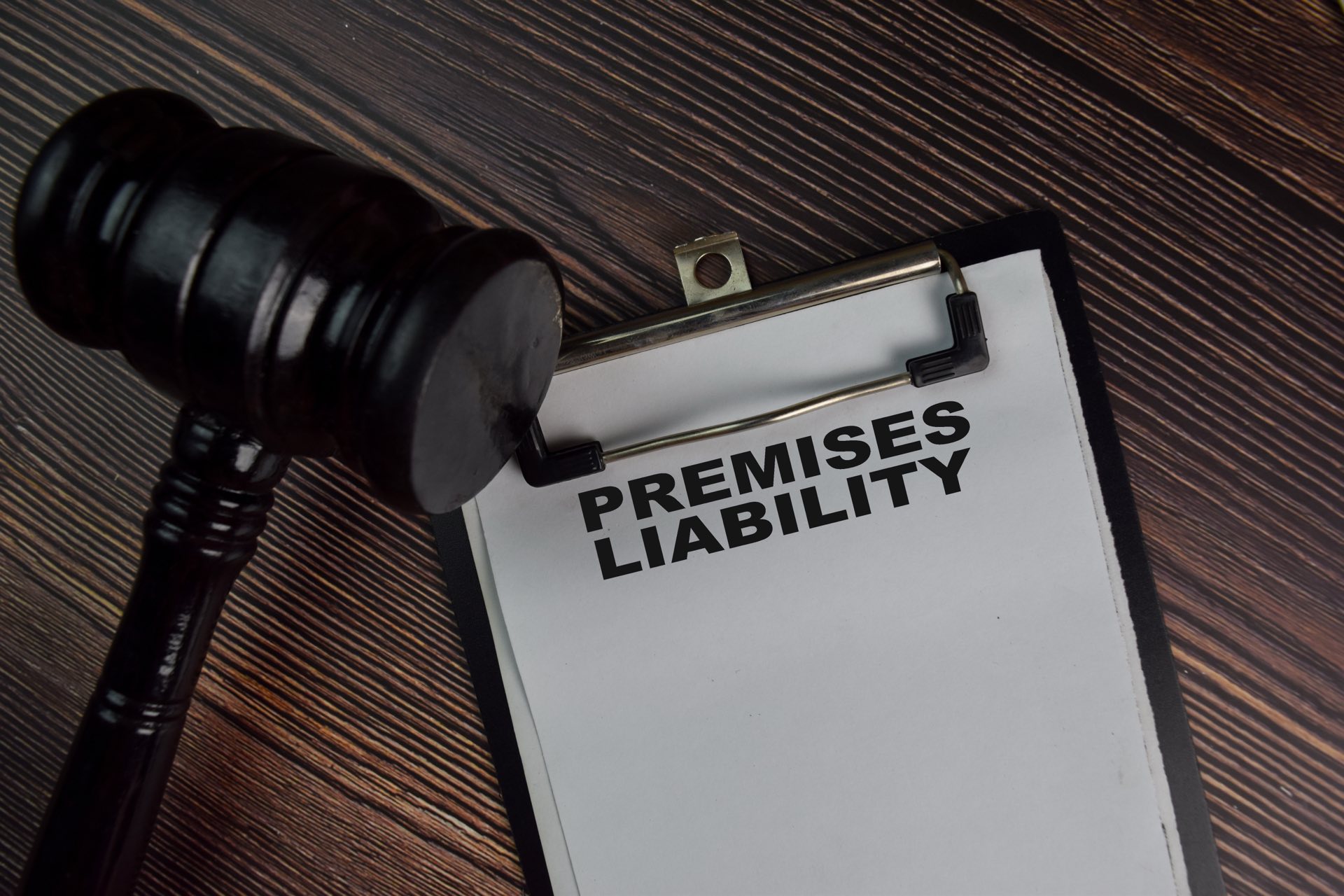 Clipboard that says premises liability next to a gavel