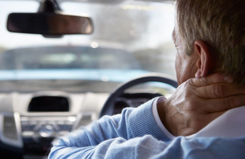 Driver In Pain After Traffic Collision | Motor Vehicle Accident Lawyers NYC | Gash & Associates, P.C