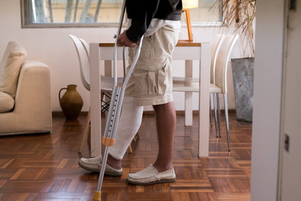 Person with broken leg and crutches