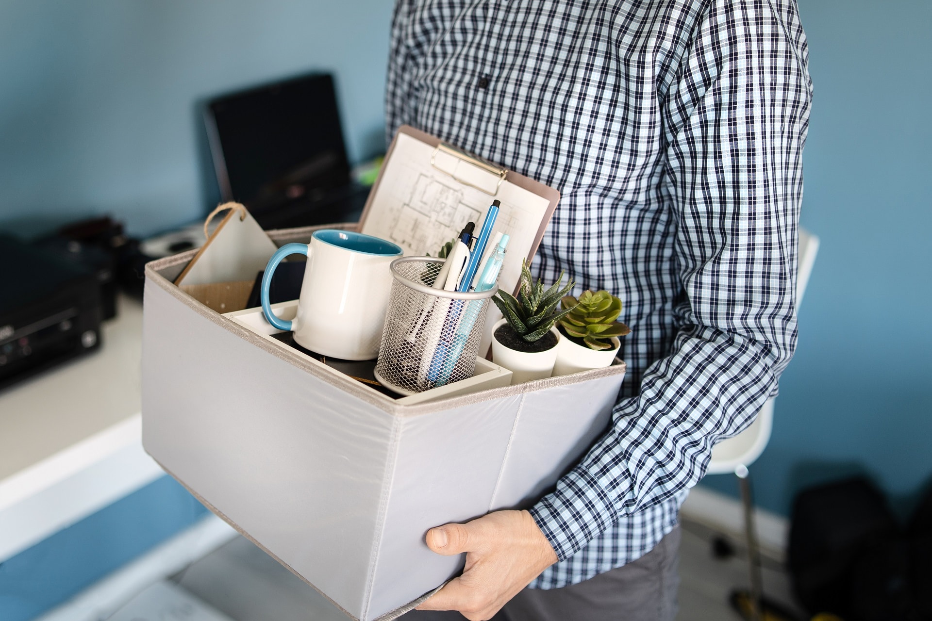 Man Holding A box Leaving The Office | Employment Discrimination Lawyer | Gash & Associates, P.C.