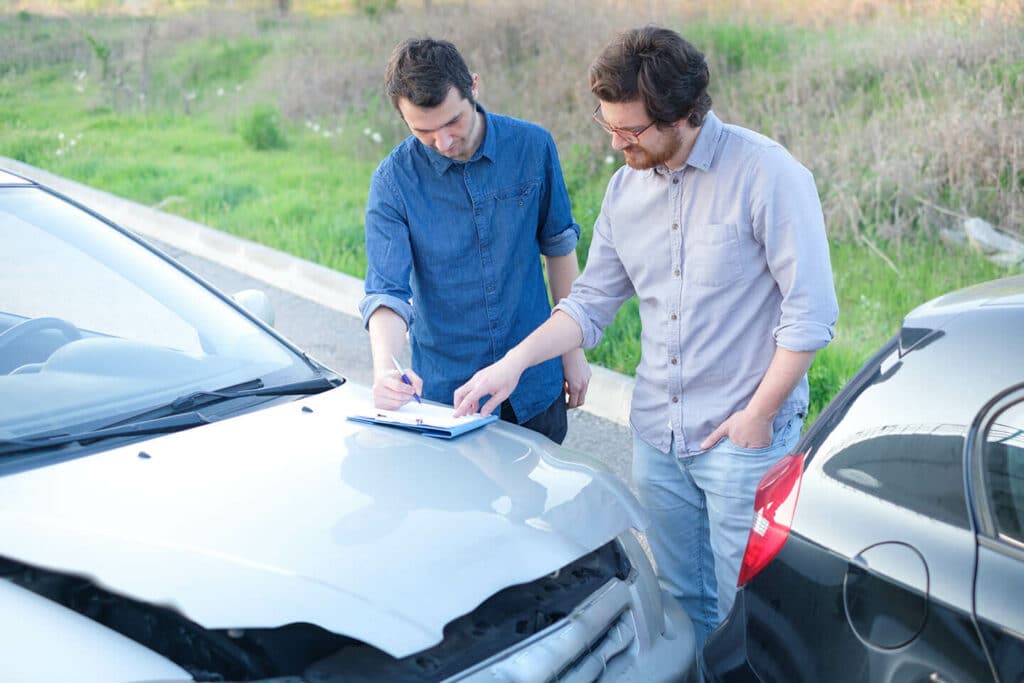 Men On A Friendly Agreement After A Crash | Motor Vehicle Accident Lawyer | Gash & Associates, P.C.