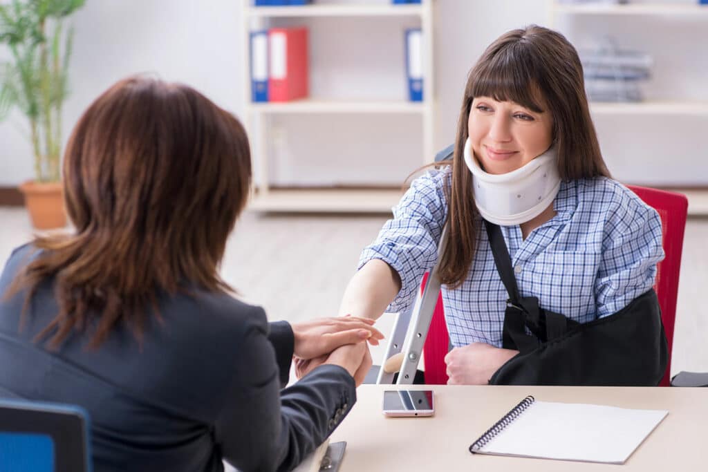 Injured Woman Visiting Lawyer For Advice | Personal Injury Law Firm in NYC | Gash & Associates, P.C.