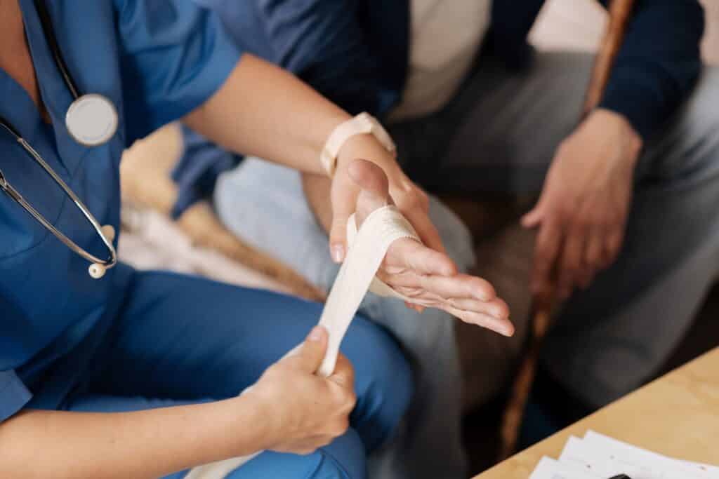 Doctor Treating Her Patient's Arm injury | Personal Injury Law Firm in NYC | Gash & Associates, P.C.