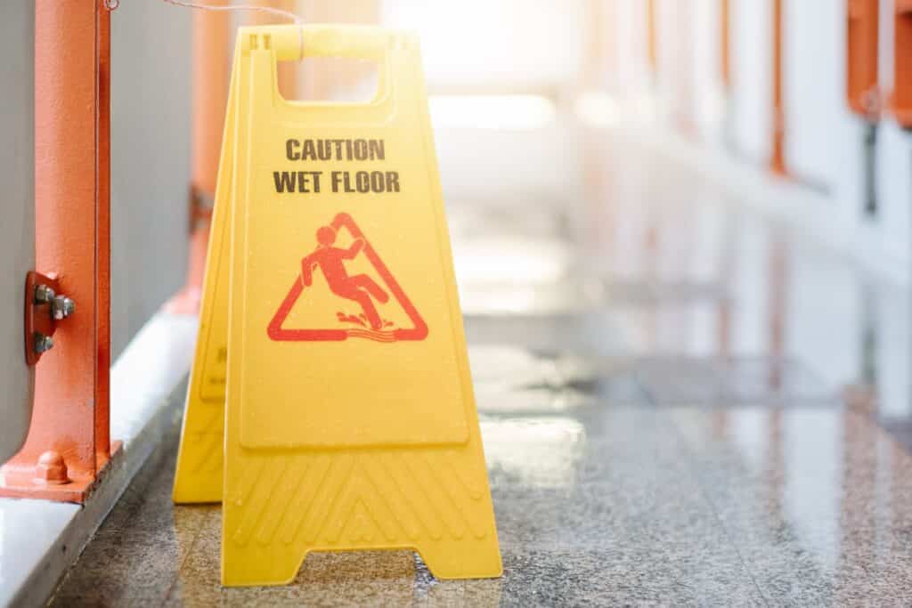 Yellow Warning Sign for Wet Floor | Slip and Fall Accident Attorneys | Gash & Associates, P.C.